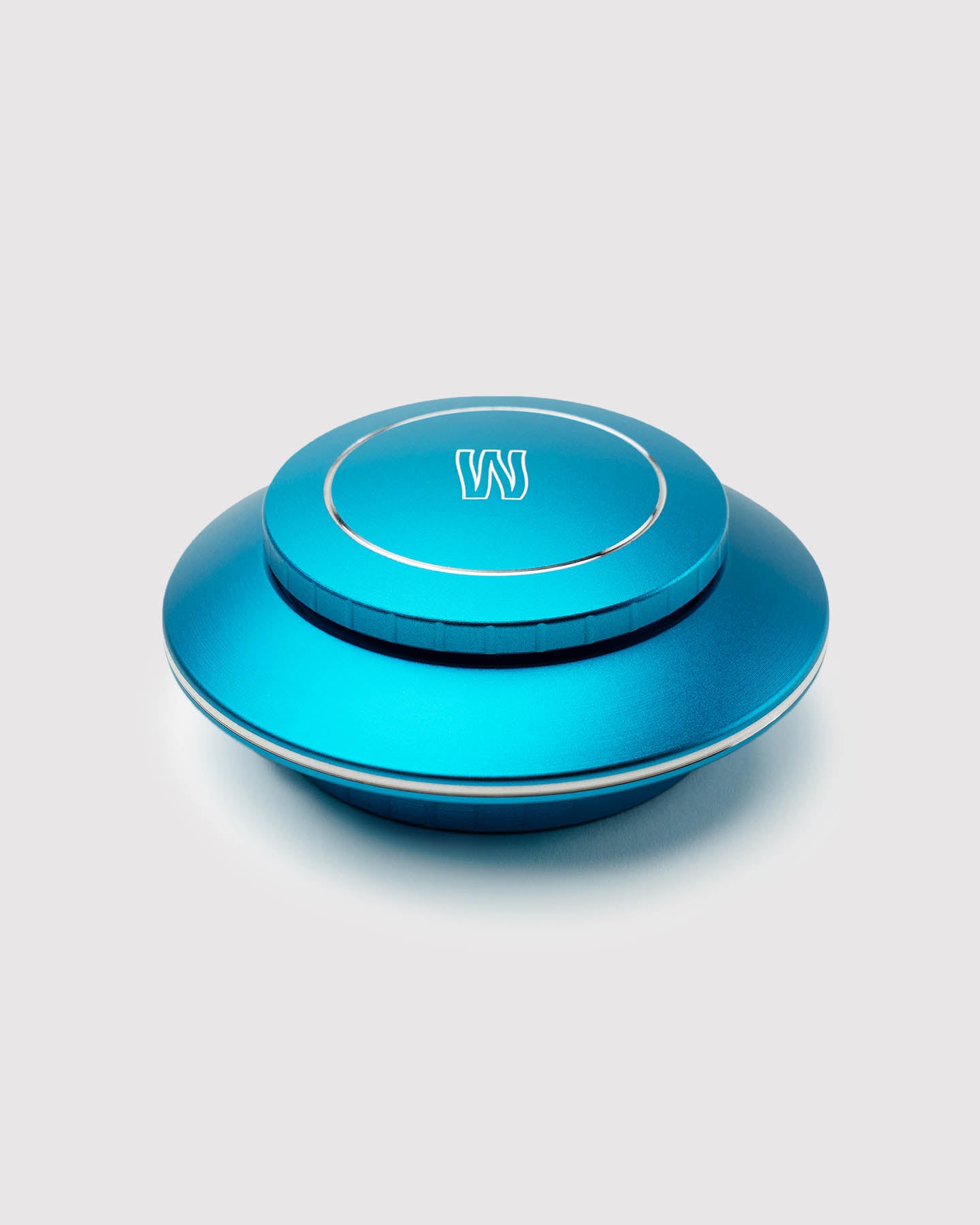 4 piece ufo grinder against a white background