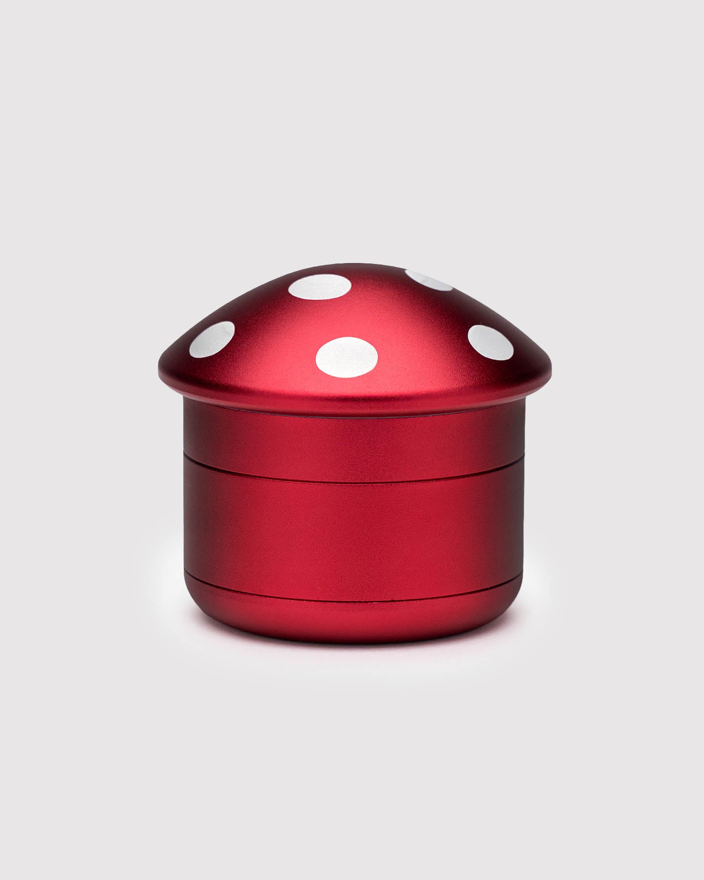 4 piece red mushroom grinder against a white background