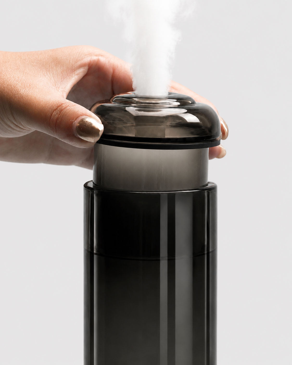 closeup of black glass gravity bong in use