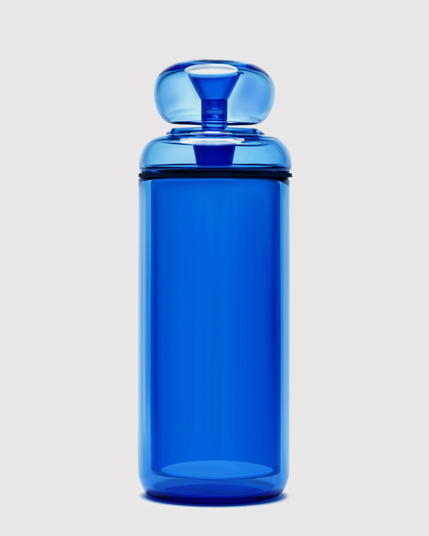 blue glass gravity bong against white background 