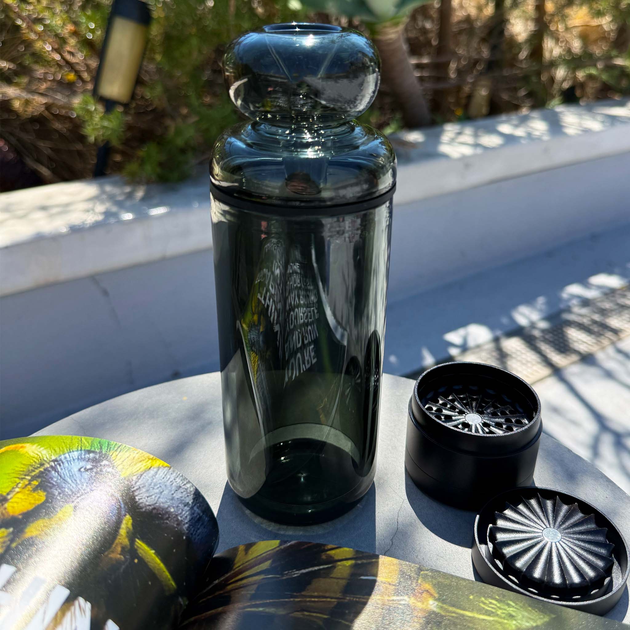 black classic gravity bong with toothless grinder on table top