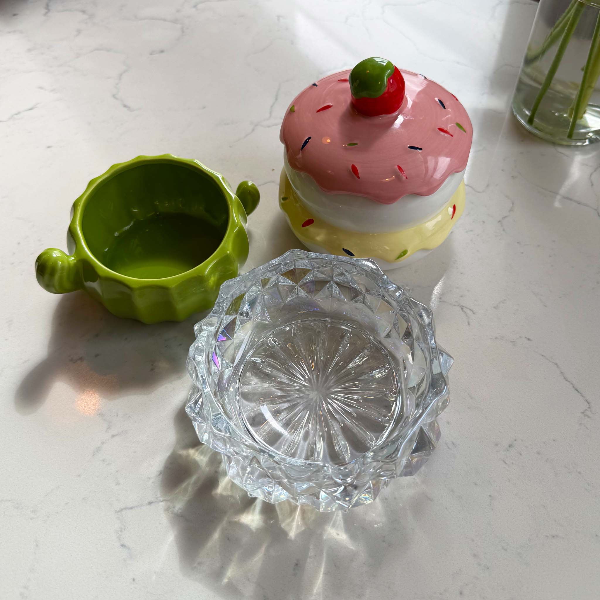 glass and ceramic ash trays on marble table 