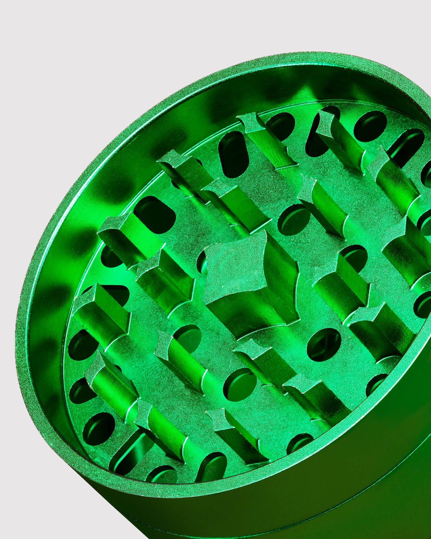 closeup of green metal grinder 