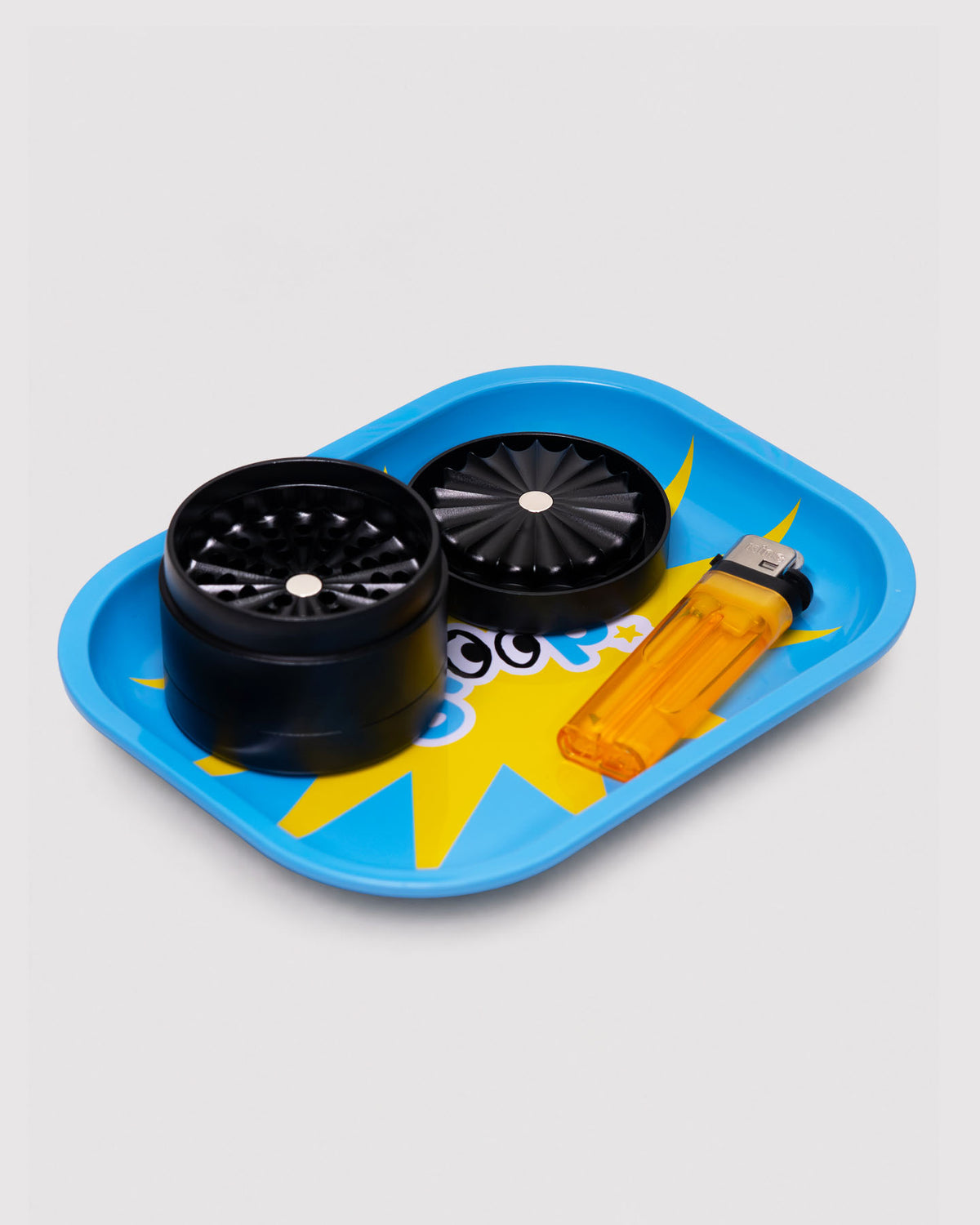 lighter and blue toothless grinder on rolling tray