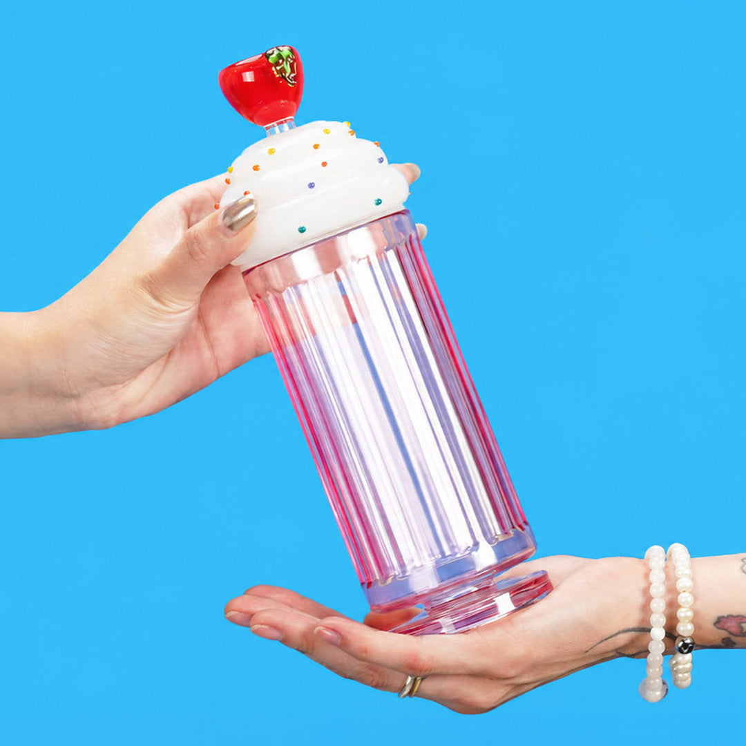 hands passing milkshake gravity bong in mobile banner format