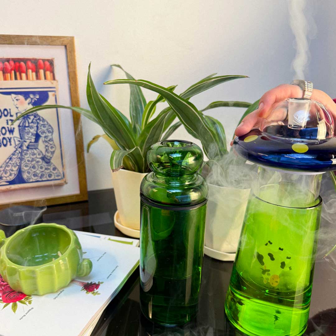 green classic gravity bong and ufo alien gravity bong in use 