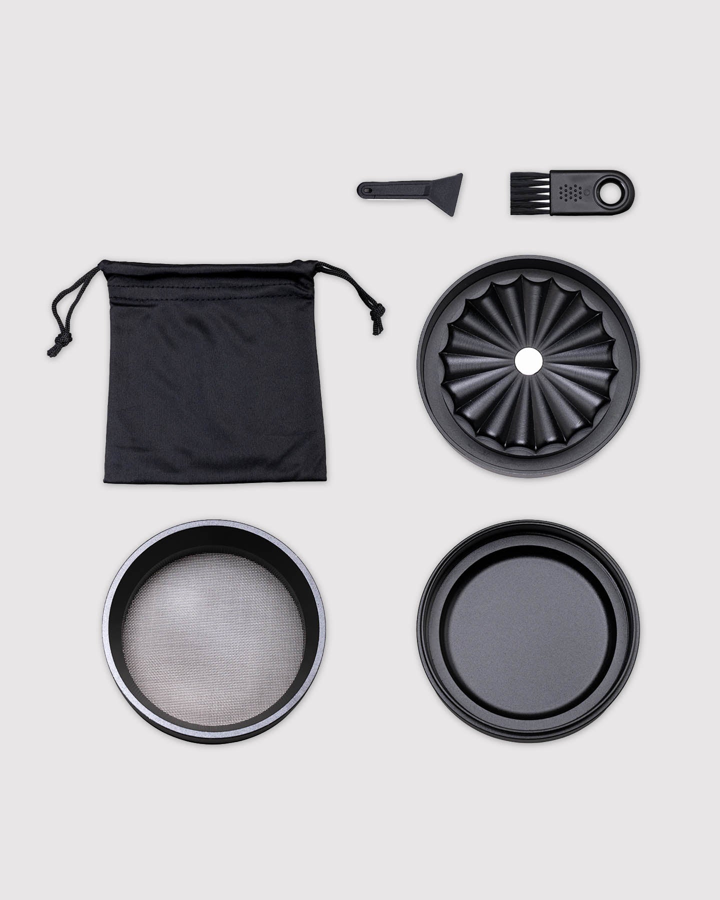 what's included image, black toothless grinder disassembled with carrying pouch and cleaning tools 
