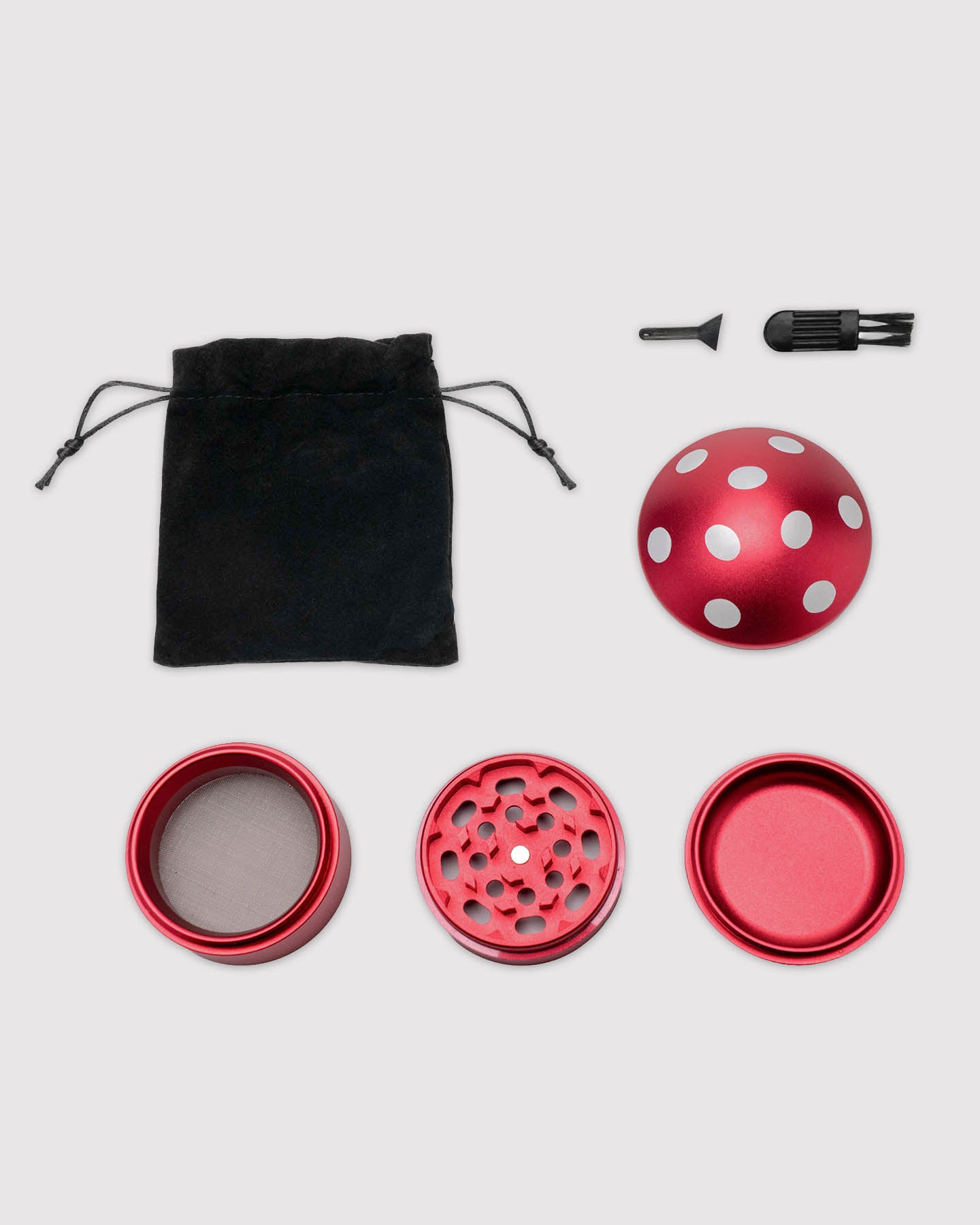 what's included image, red mushroom grinder disassembled with carrying pouch and cleaning tools 